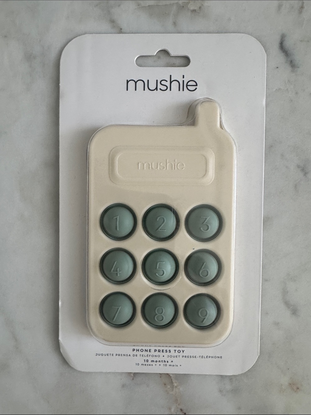 mushie Cream Baby Phone Case with Sage Buttons
